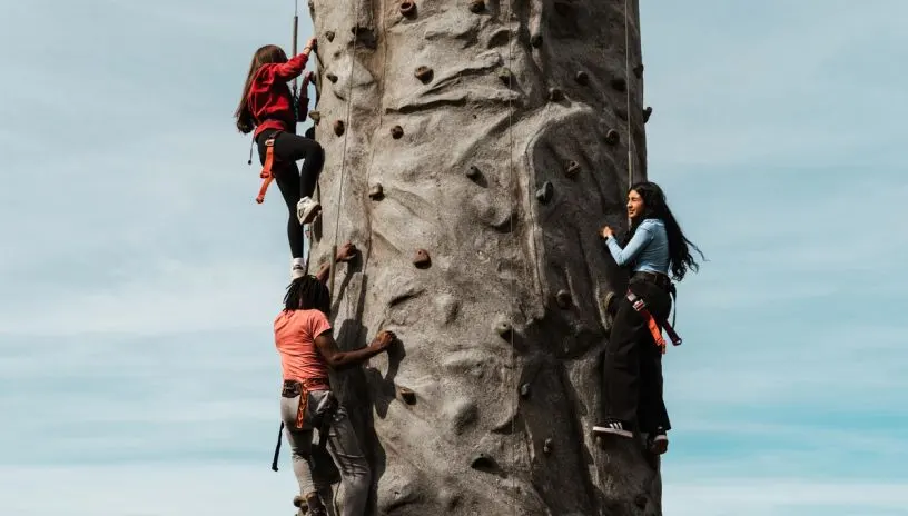 People rock climbing